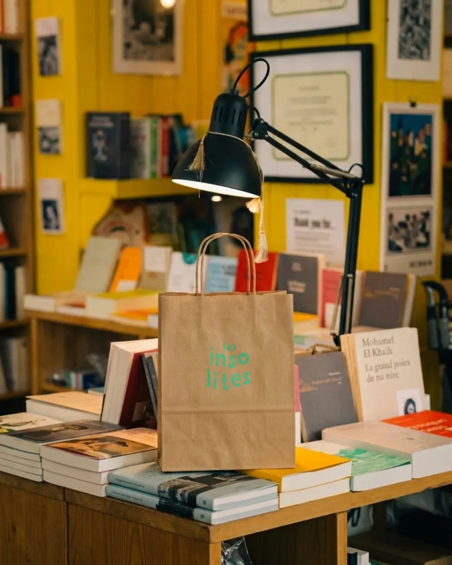 Kraft paper bag printed with the logotype in the bookshop