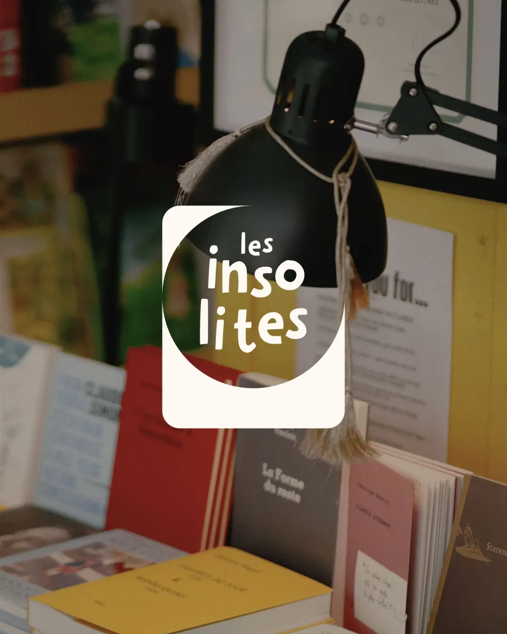 The logotype sticker on a black desk lamp