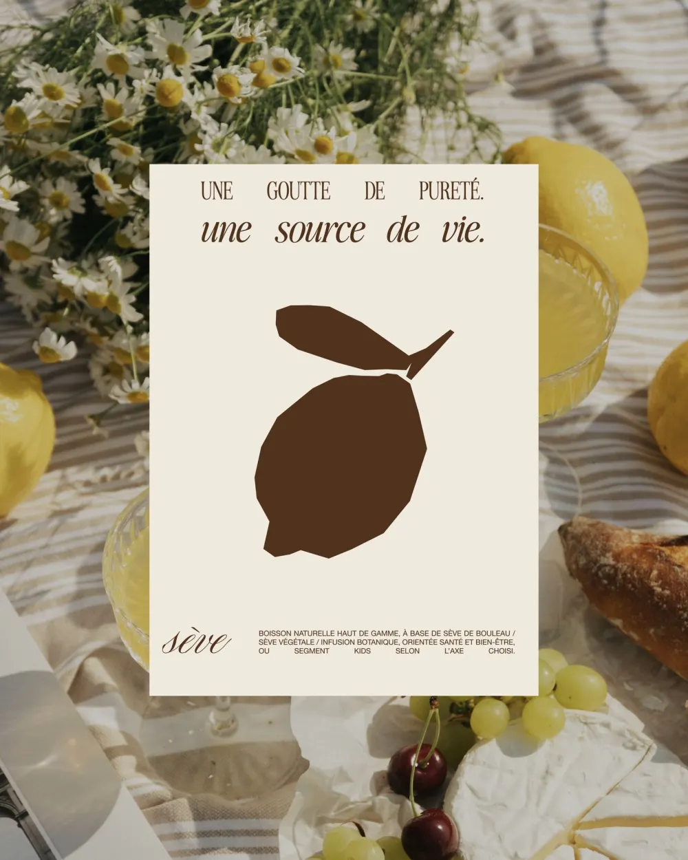 Poster with a brown lemon on a picnic with chamomile